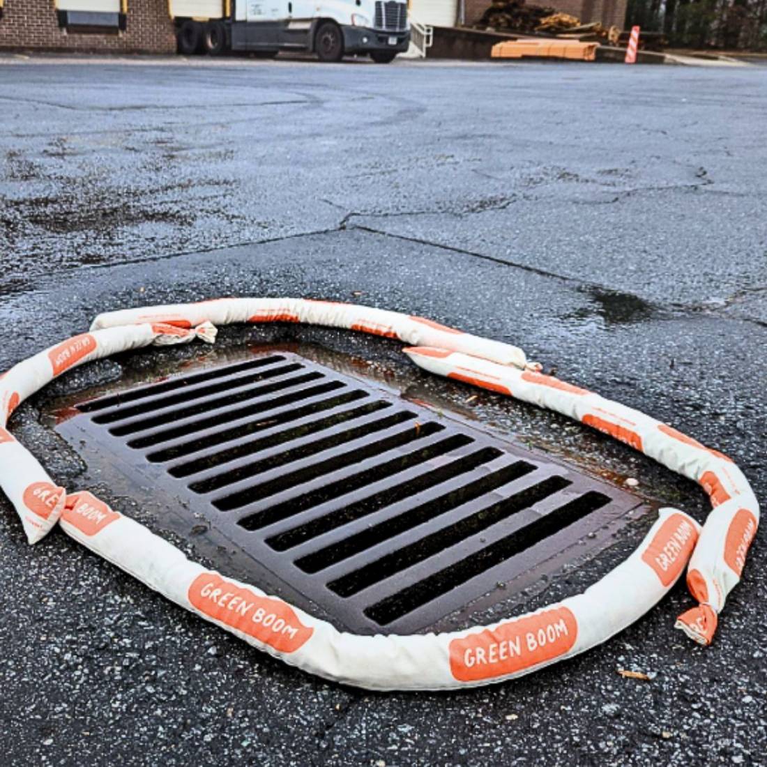 Green Boom sock protecting a storm drain